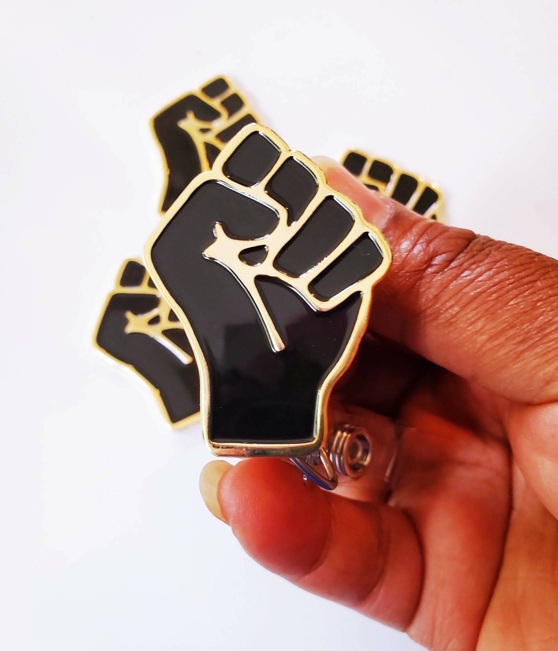 Black Fist Badge Reel – SIBEXPO