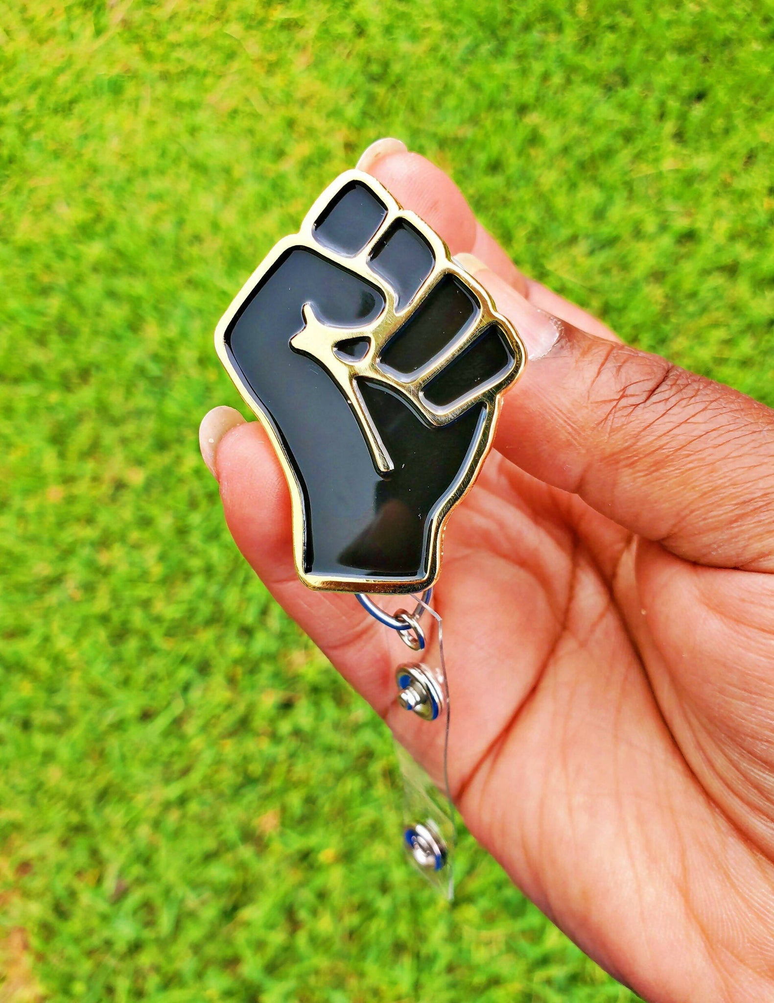 Black Fist Badge Reel